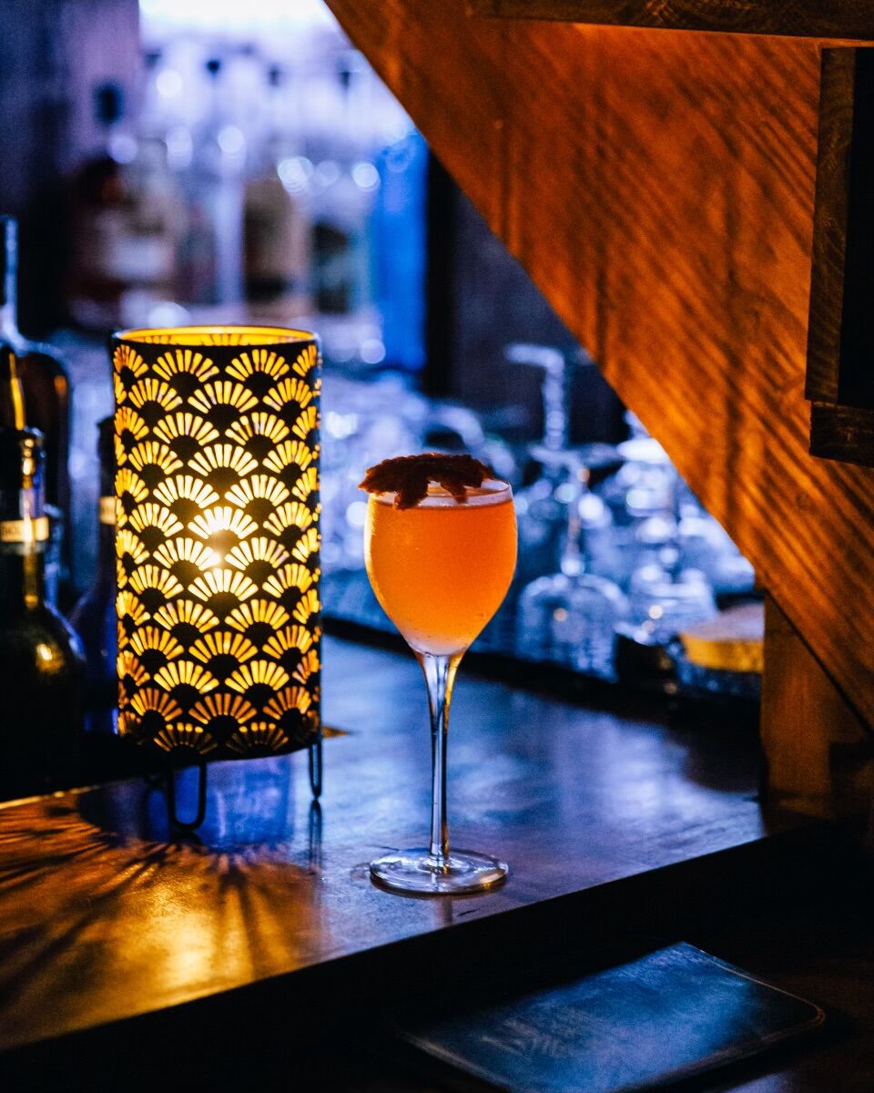 new society drink red with bar background